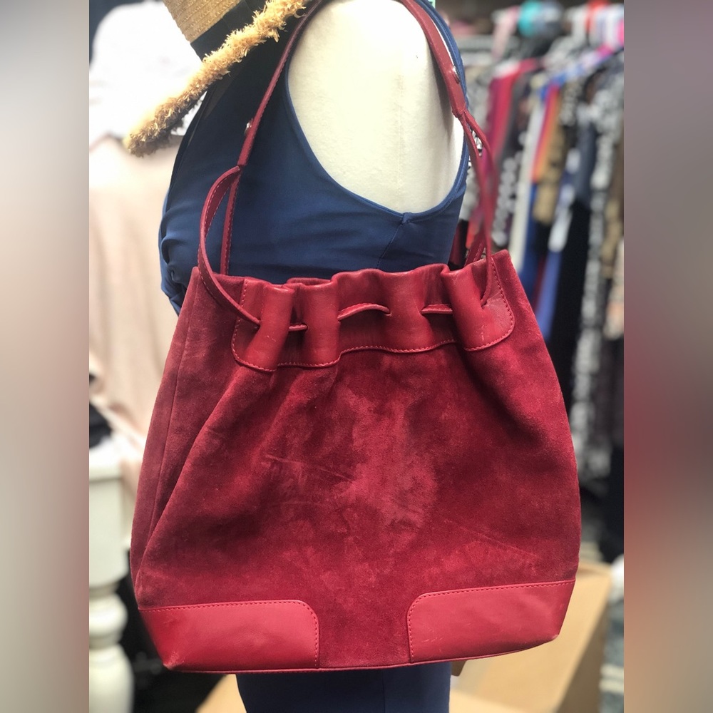 Burberry red suede handbag.  There are imperfections due to wear. See pics.